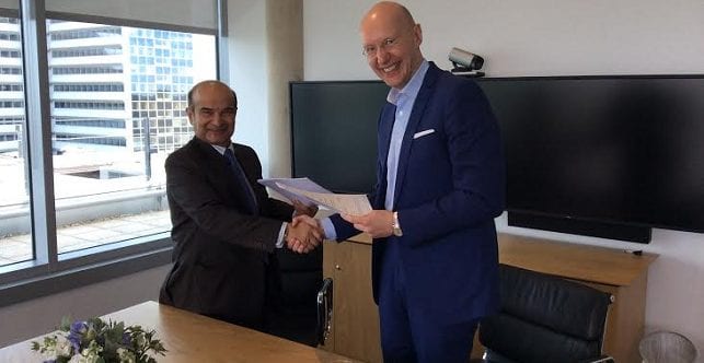 Bashirali Currimjee concluding a strategic telecommunications partnership agreement